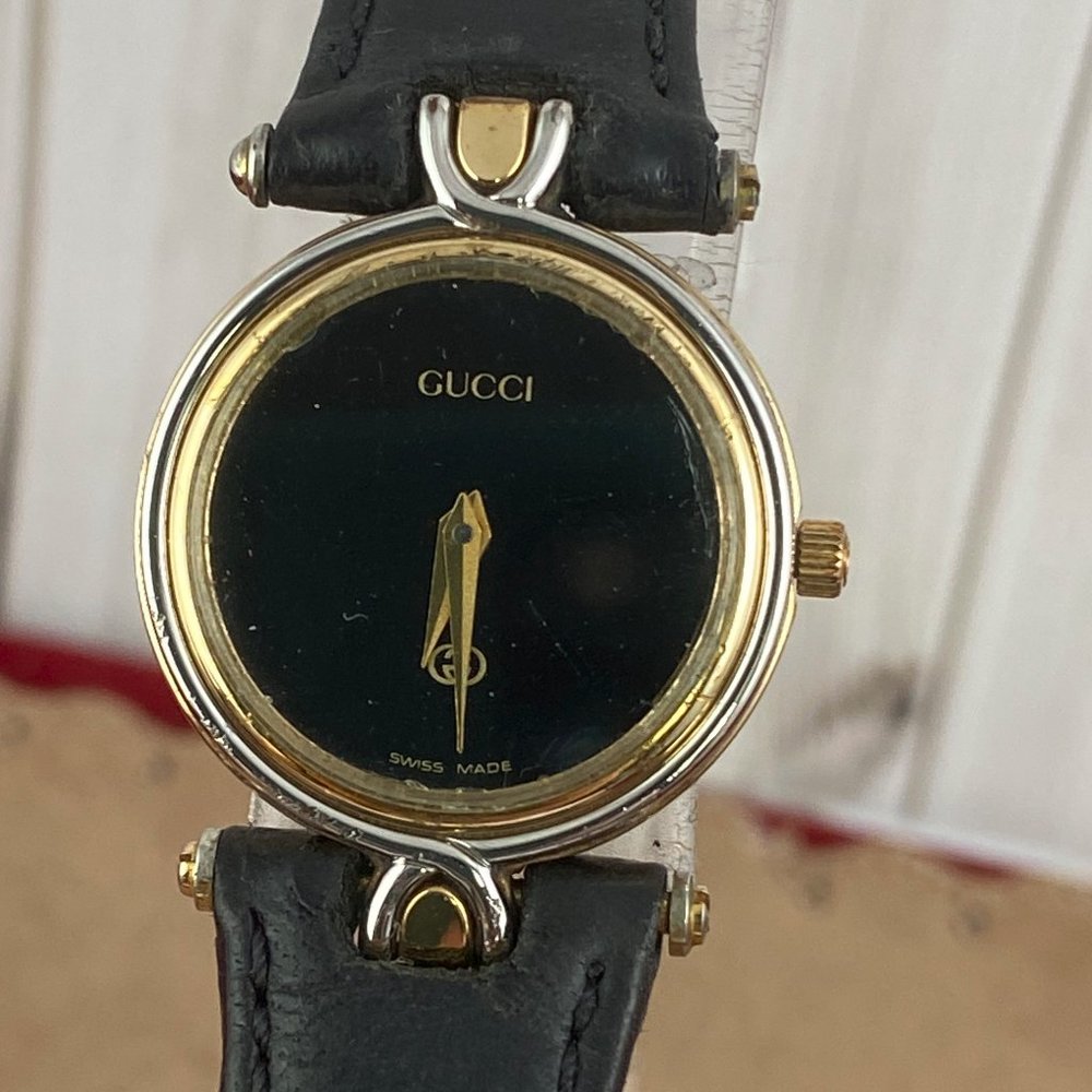 Vintage Gucci 4500L  watch with Black Enamel face Gold sword hands Fancy T Lugs